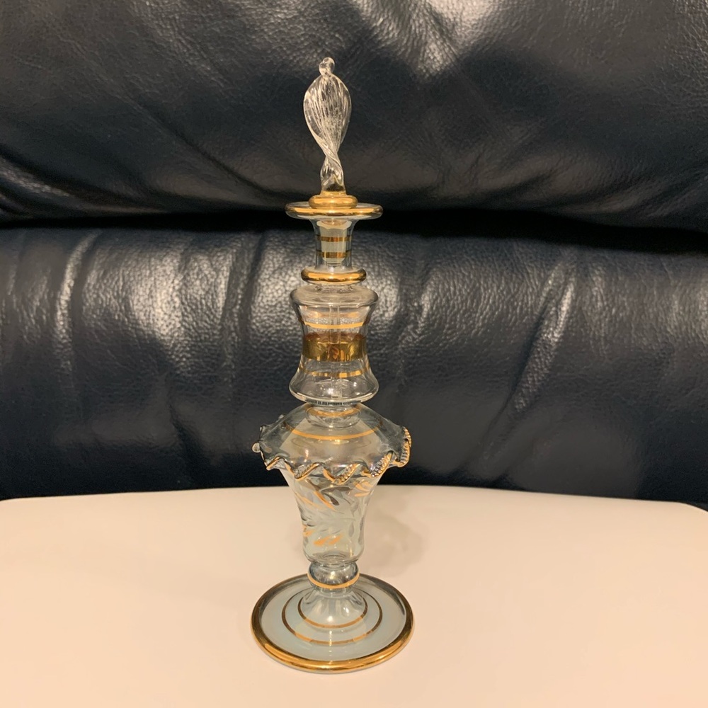 Glass jar with glass dropper stick.